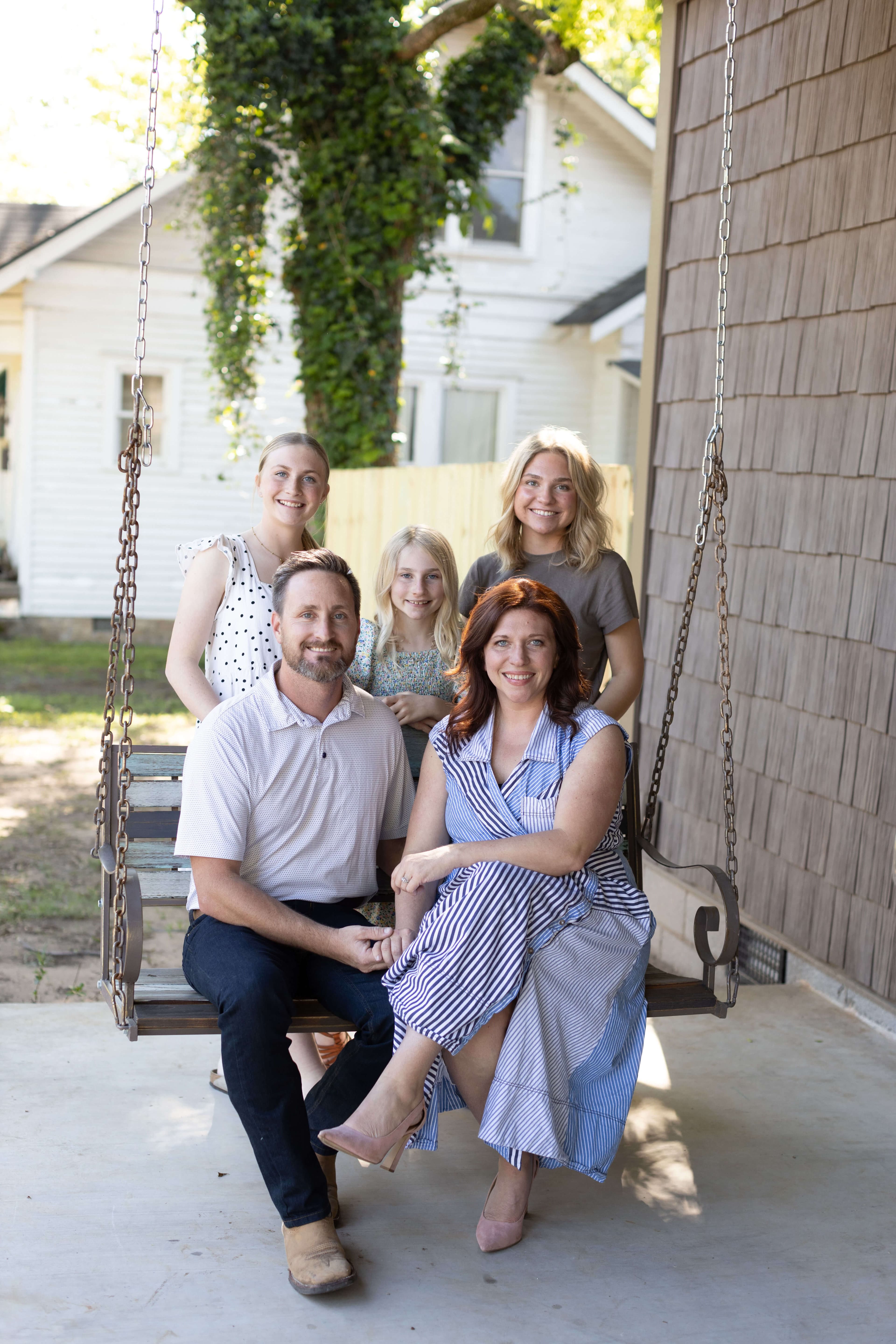 Crystal with family on porch swing